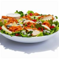 Hooters Original Buffalo Chicken Salad · Spring mix greens stacked with breaded chicken tossed in your favourite wing sauce. Topped w...