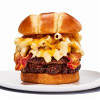 The Bacon Mac and  Cheese Burger · Experience burger bliss with crispy bacon and creamy macaroni and cheese on our ½ pound burg...