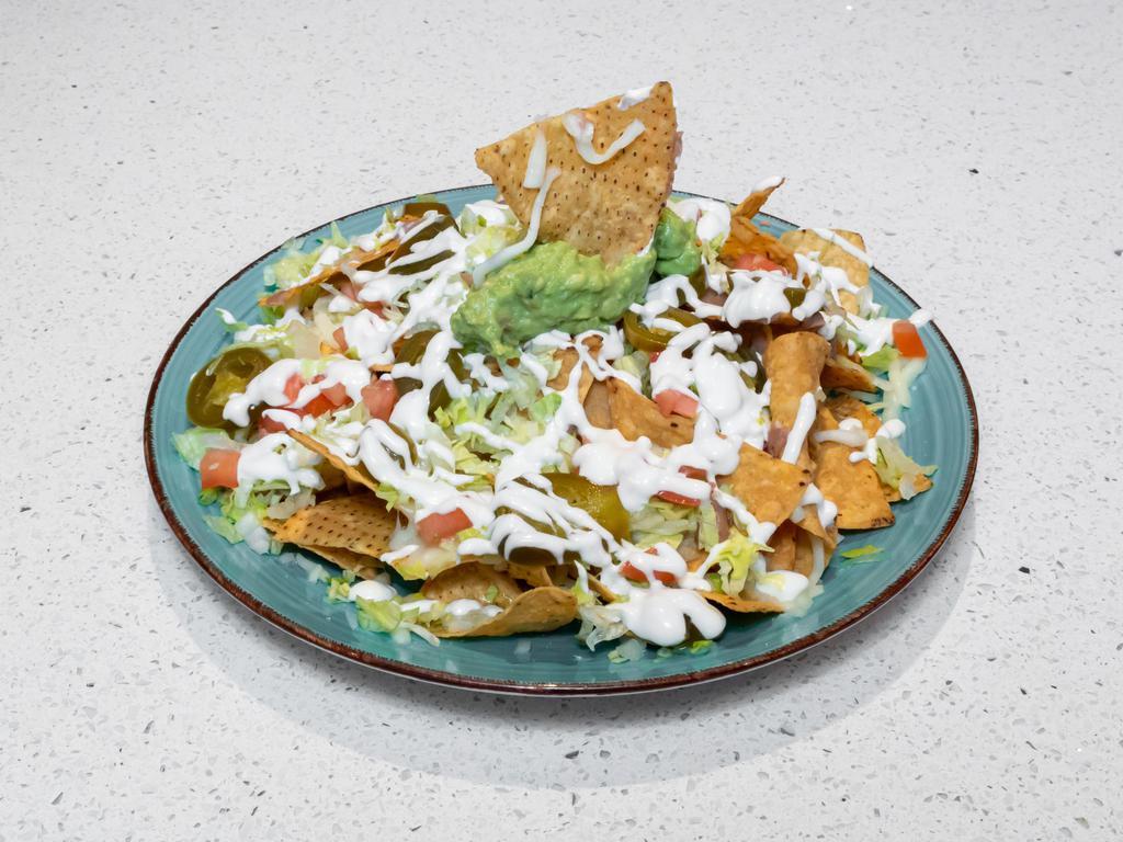 Maria's Todos Nachos · Fresh tortilla chips with beans lettuce, tomato, sour cream, guacamole, onion, cheese, pickled jalapenos.