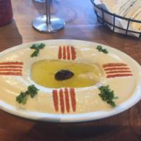 Hummus · A delightful dip of garbanzo beans with garlic, tahini, olive oil and lemon juice. Vegan and...