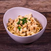Fettuccine Alfredo with Chicken · Chicken sauteed with fresh garlic added to fettuccine and in-house, freshly-made Alfredo sau...