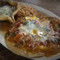 Huevos Rancheros · Tortillas, 2 Eggs, Ranchero Sauce, Beans and Potatoes