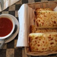 1/2 Order Garlic Cheese bread · 2 Slices of our fabulous garlic bread topped with mozzarella, Romano and Parmesan cheeses se...