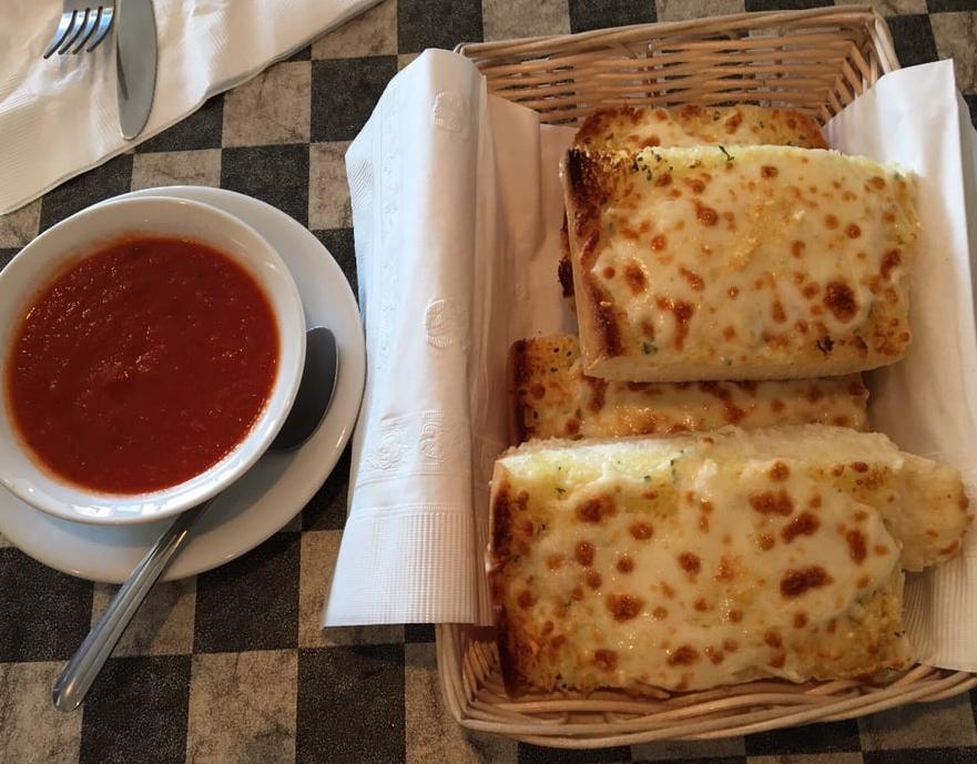 Garlic Cheese Bread · 4 Slices of our fabulous garlic bread topped with mozzarella, Romano and Parmesan cheeses served with a side of marinara sauce.