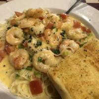 Shrimp Scampini · 12 sauteed shrimp with garlic butter, green onions, tomatoes and white wine tossed in a ligh...