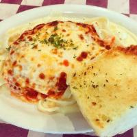 Chicken Parmesan · Tender hand breaded chicken breasts topped with marinara sauce, mozzarella and Parmesan chee...