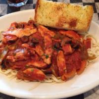 Chicken Cacciatore · Tender slices of grilled chicken in a spicy tomato sauce with bell peppers, onions, olives, ...