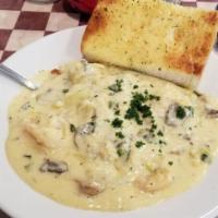 Shrimp Gorgonzola · 12 large Sauteed shrimp with green onions, artichoke hearts and mushrooms in a tangy Gorgonz...