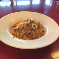 Seafood Pasta · Jumbo shrimp, baby clams, calamari, tossed with fire roasted tomatoes, fresh garlic, white w...