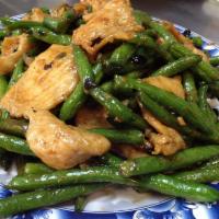String Bean Chicken · Sliced white meat chicken with string beans stir fried in a black bean sauce. Served with ri...