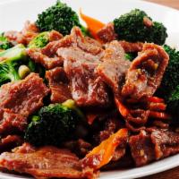 Broccoli Beef · Tender beef strips with broccoli, carrots and onion stir fried in a brown sauce. 