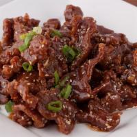 Sesame Beef · Crispy beef glazed with a sweet sesame sauce. Served with rice.
