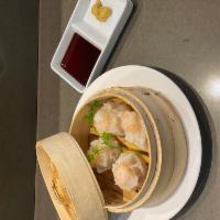 Shrimp Dumpling · 4 pieces. Steamed shrimp dumpling served with special soy sauce and mustard.