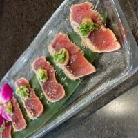 Peppered Tuna Sashimi · Thinly sliced seared tuna served with special soy sauce.