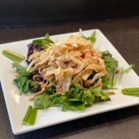 Asian Chicken Salad · Shredded marinated chicken breast over organic mixed greens with house-made peanuts creamy d...