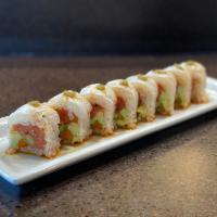 Hot Cutie Roll · Spicy tuna, avocado, cucumber, and gobo rolled in soy paper topped with seared white fish wi...