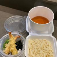 Tempura Udon · Noodle soup served with shrimp tempura, wakame, and scallions.