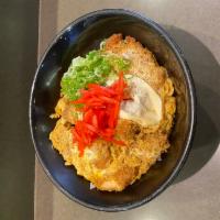 Chicken Katsu Don Lunch · Deep-fried panko-breaded chicken breast served with semi-raw egg and onion over a bed of rice.
