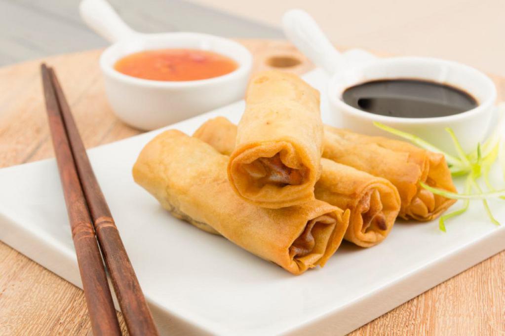 Spring Roll · Slightly fried veggie rolls served with sweet chili sauce. Vegetarian.