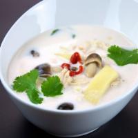 Tom Kha Soup · Coconut milk soup infused with lemongrass, galangal, Thai spices and mushrooms. Spicy.