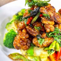 Crispy Chicken Basil Entree · Slightly fried, golden chicken glaze over a high heat wok with spicy basil sauce. Served wit...