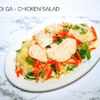 Chicken Cabbage Salad - Goi Ga · Shredded chicken with garlic, cabbage, shredded carrots and daikon, topped with peanuts. Ser...
