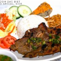 C1. Com Dac Biet · Our signature rice plate served with grilled pork, fried shrimp on a sugarcane, egg cake and...