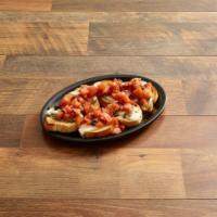 Bruschetta · Sliced baguette with fresh, melted mozzarella cheese. Served with diced Roma tomatoes, shall...