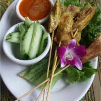 Chicken Satay · Yellow Curry & Coconut Marinated Grilled Chicken Skewers with Peanut Sauce, Cucumbers & Daik...