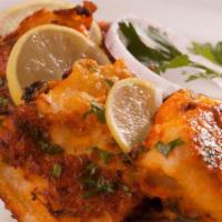 Fish & Fries (Lahori) · Slices of fish marinated with garlic, herbs, Lahore masala dipped in gram flour batter fried...