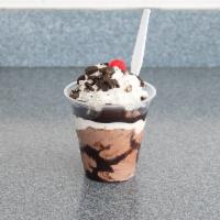 Mud Sundae · Chocolate frozen custard, chocolate syrup, marshmallow creme and Oreo cookies. Add extra top...