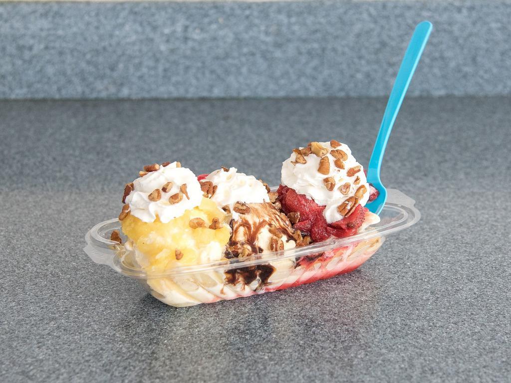 Banana Split Sundae · Chocolate syrup, strawberries, pineapple and toasted pecans. Add extra toppings for an additional charge.