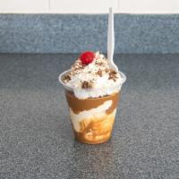 Peanut Butter Mountain Sundae · custard, peanut butter topping and Reese's cup.