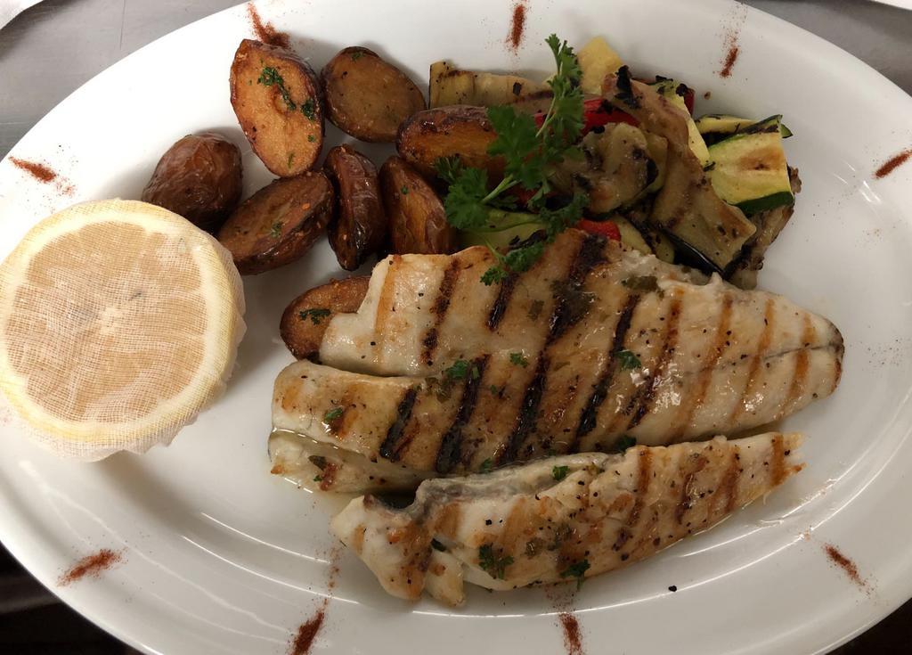 Branzino · Grilled mediterranean sea bass served with roasted potatoes and sauteed mixed vegetables.
