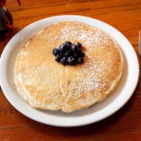 2 Blueberry Pancakes · 2 blueberry-filled plate size pancakes. Dusted with powder sugar and served with butter and ...