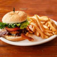 Cowboy Burger · Crispy bacon, Jack cheese, onion rings and BBQ sauce. Prepared with mayonnaise, lettuce, tom...