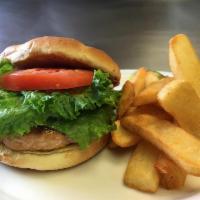 Cajun Salmon Burger · Salmon patty, lettuce, tomato and onion with Cajun aioli on sesame bun. Prepared with mayonn...
