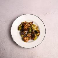 Roasted Brussels Sprouts · Tender Brussels, crisp bacon and balsamic reduction.