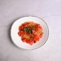 Spaghetti Pomodoro · Organic local tomatoes, fresh basil and garlic, lightly sauteed with extra virgin olive oil.