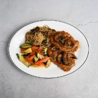 Chicken Marsala · Tender chicken breast sauteed with fresh mushrooms and Marsala wine, served with spaghetti M...