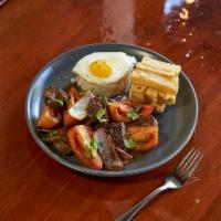 Lima Lomo Saltado with Egg · Comes with traditional sunny side up egg. Traditional beef stir-fry with onion and tomato in...