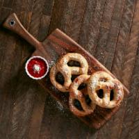 Pretzels · Signature mellow dough twisted into pretzels. Choice of garlic butter and Parmesan with a si...