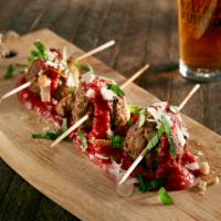 Meatball Trio · 3 meatballs grilled with fresh mozzarella on a bed of Mellow red sauce with shaved Parmesan ...