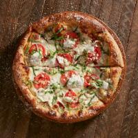 Great White Pie · Olive oil and garlic base with roasted tomatoes, provolone, feta cheese, seasoned ricotta, f...