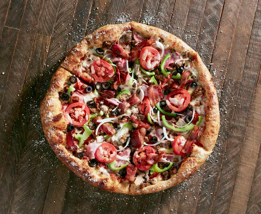 House Special Pie · Mellow red sauce with mozzarella, pepperoni, sausage, ground beef, ham, applewood smoked bacon, mushrooms, black olives, Roma tomatoes, green peppers and onions.
Topped with extra mozzarella.
