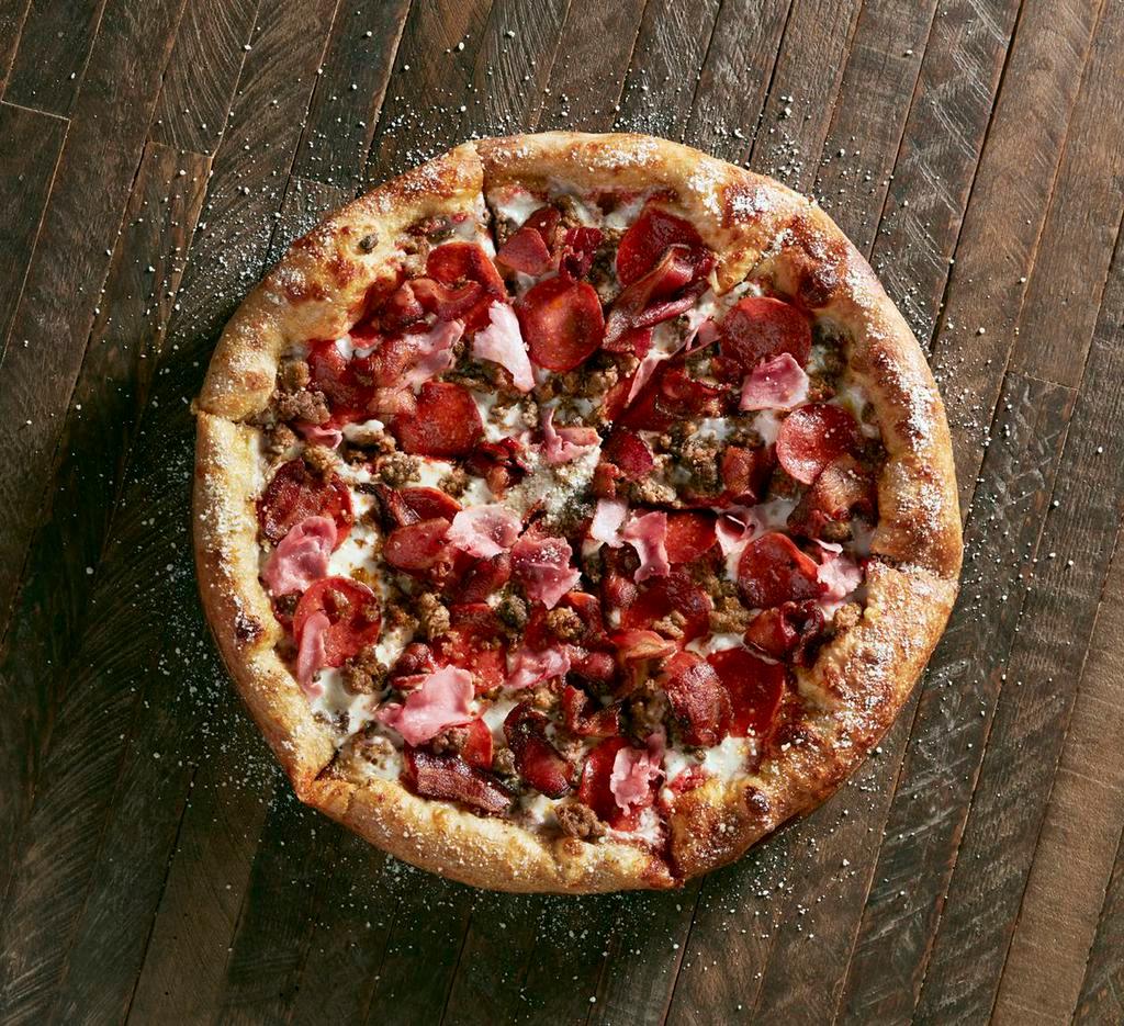Mighty Meaty Pie · Mellow red sauce with mozzarella, pepperoni, sausage, ground beef, ham and applewood smoked bacon.