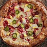 Pacific Rim Pie · Mellow red sauce with mozzarella, ham, bacon, caramelized onions, pineapple and jalapenos.