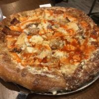 Buffalo Chicken Pie · Mozzarella, all-natural buffalo chicken, caramelized onions and applewood smoked bacon with ...