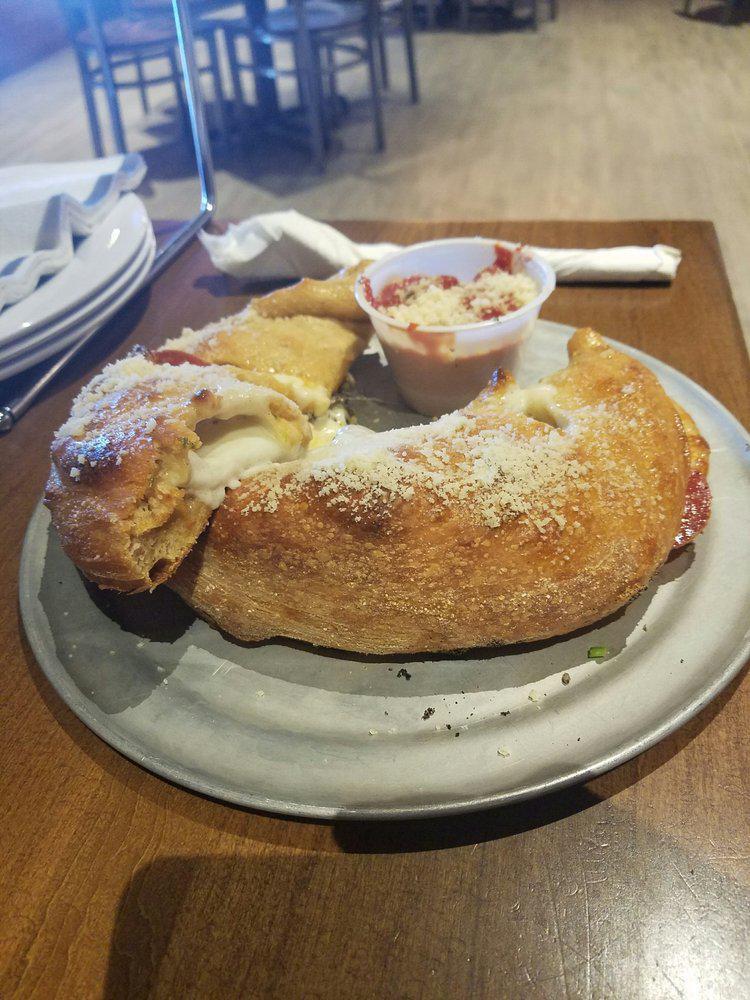Cheese Calzone · Stuffed with mozzarella, provolone and seasoned ricotta, then basted with garlic butter and sprinkled with Parmesan. Lacto-ovo vegetarian.