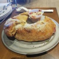Steak and Cheese Calzone · Grilled, shaved all-natural ribeye steak with mushrooms, onions, green peppers, seasoned ric...